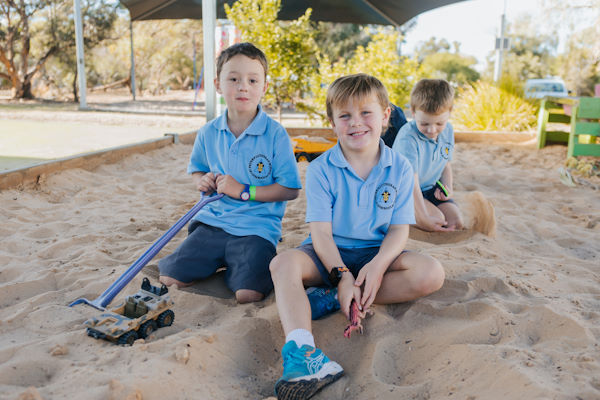 Students in a sandpit.